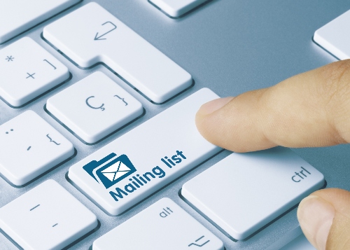 finger pressing a keyboard with a key for Mailing List